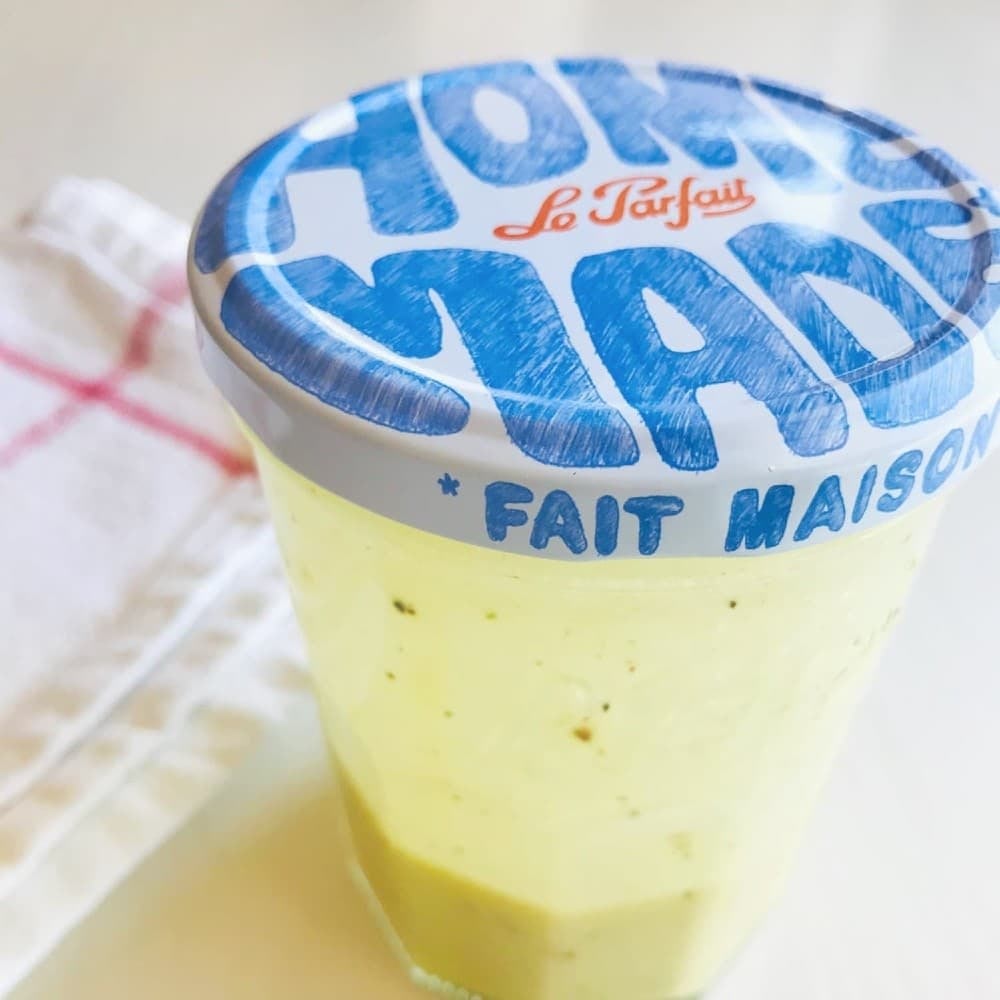 healthy salad dressing recipes, clear glass jar with a lid with "homemade" written, filled with light yellow creamy dressing